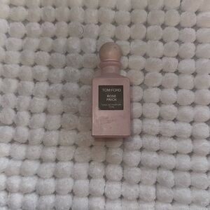 Empty Tom Ford Rose Pick perfume bottle